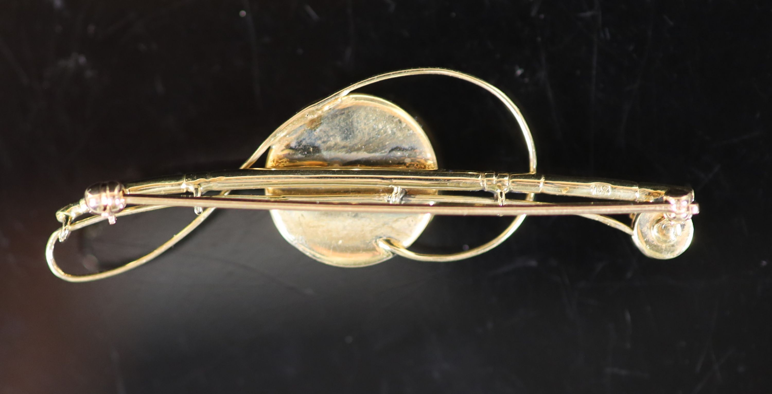 An Edwardian 18ct gold and Essex crystal set bar brooch, modelled as a fly fishing rod, with line and reel